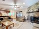 Bright living room with a stone fireplace and comfortable seating at 4711 County Road 134, Wildwood, FL 34785