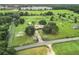 Aerial view of property showing house and road at 4711 County Road 134, Wildwood, FL 34785