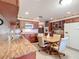 Kitchen boasts granite countertops, wood cabinets, and breakfast nook at 4711 County Road 134, Wildwood, FL 34785