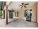 Covered back patio with ceiling fans, storage shed, and access to the interior at 16208 Magnolia Hill St, Clermont, FL 34714