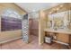 Main bathroom with walk-in shower and double vanity at 16208 Magnolia Hill St, Clermont, FL 34714