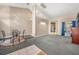 Spacious living room with vaulted ceilings, carpeted floors, and plenty of natural light at 16208 Magnolia Hill St, Clermont, FL 34714