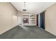 Spacious living room featuring a neutral color palette and carpet flooring at 16208 Magnolia Hill St, Clermont, FL 34714