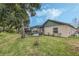 Landscaped backyard with spacious grassy area and pool at 16208 Magnolia Hill St, Clermont, FL 34714