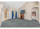 Open living room with a view into another room and a carpeted floor at 16208 Magnolia Hill St, Clermont, FL 34714
