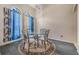 Cozy dining nook with a round glass table and four chairs at 16208 Magnolia Hill St, Clermont, FL 34714