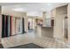Kitchen with breakfast bar and view into living area at 16208 Magnolia Hill St, Clermont, FL 34714