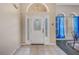 Interior view of the front door with glass panels and sidelights at 16208 Magnolia Hill St, Clermont, FL 34714