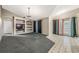 Bright living room with built-in shelving and carpet flooring at 16208 Magnolia Hill St, Clermont, FL 34714