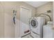 Laundry room with washer, dryer, and exterior access at 16208 Magnolia Hill St, Clermont, FL 34714