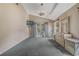 Bright bedroom with carpet, and access to patio at 16208 Magnolia Hill St, Clermont, FL 34714