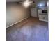 Spacious living room with carpeted floors and a ceiling fan at 6312 Raleigh St # 513, Orlando, FL 32835