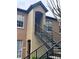 Exterior view of condo building with stairs and two entrances at 6312 Raleigh St # 513, Orlando, FL 32835