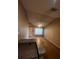 Living room with vaulted ceiling, carpet flooring, and a view of the kitchen at 6312 Raleigh St # 513, Orlando, FL 32835