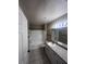 Bathroom with granite countertop, white vanity, and a bathtub at 6312 Raleigh St # 513, Orlando, FL 32835