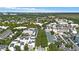Aerial view of a town featuring a lake and residential areas at 720 Celebration Ave # 220, Celebration, FL 34747