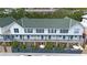 Aerial view of a townhome community showcasing multiple units with green roofs and private patios at 720 Celebration Ave # 220, Celebration, FL 34747