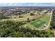 Aerial view of community with golf course, lake, and soccer field at 720 Celebration Ave # 220, Celebration, FL 34747