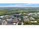 Aerial view of a picturesque town, featuring a lake and various buildings at 720 Celebration Ave # 220, Celebration, FL 34747