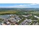 Aerial view of a town center with lake and lush greenery at 720 Celebration Ave # 220, Celebration, FL 34747