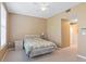 Main bedroom with a double bed, nightstand, and ceiling fan at 720 Celebration Ave # 220, Celebration, FL 34747