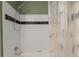 Shower and tub with leaf patterned curtain at 720 Celebration Ave # 220, Celebration, FL 34747