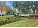 Landscaped area with bridge, water feature, and lush greenery at 720 Celebration Ave # 220, Celebration, FL 34747