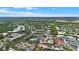 Aerial view of a town with a large lake and surrounding landscape at 720 Celebration Ave # 220, Celebration, FL 34747