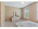 Bright bedroom with dresser and large window at 720 Celebration Ave # 220, Celebration, FL 34747