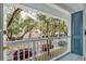 Balcony view of a residential street with mature trees and parked cars at 720 Celebration Ave # 220, Celebration, FL 34747
