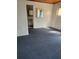 Simple bedroom with carpeted floor and access to bathroom at 10 Mccarthy Ave, Frostproof, FL 33843