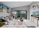 Living room with sliding glass doors leading to a balcony overlooking scenic views at 1052 Lotus Cove Ct # 743, Altamonte Springs, FL 32714
