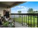 Balcony with comfortable seating and a view of the lake at 1052 Lotus Cove Ct # 743, Altamonte Springs, FL 32714