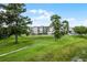 Exterior view of an apartment building near a lake with a walking path at 1052 Lotus Cove Ct # 743, Altamonte Springs, FL 32714