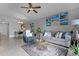 Open living space with a comfortable seating area and a view into the dining area at 1052 Lotus Cove Ct # 743, Altamonte Springs, FL 32714