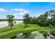 Aerial view of a lakefront property with lush green landscaping at 1052 Lotus Cove Ct # 743, Altamonte Springs, FL 32714