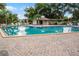 Community swimming pool with surrounding patio and seating at 1052 Lotus Cove Ct # 743, Altamonte Springs, FL 32714