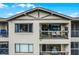 Apartment balcony with lake view and patio furniture at 1052 Lotus Cove Ct # 743, Altamonte Springs, FL 32714