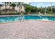 Inviting community pool with brick pavers and plenty of space for lounging at 1052 Lotus Cove Ct # 743, Altamonte Springs, FL 32714