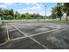 Community tennis court with fencing and surrounding trees at 1052 Lotus Cove Ct # 743, Altamonte Springs, FL 32714