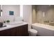 Modern bathroom with soaking tub, double vanity, and sleek fixtures at 209 N Pine Ave, Oviedo, FL 32765