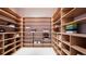 Large storage room with ample shelving for linens and sporting goods at 209 N Pine Ave, Oviedo, FL 32765