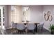 Modern dining room featuring a live-edge table and gray chairs at 209 N Pine Ave, Oviedo, FL 32765