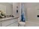 Clean bathroom with granite vanity and a shower/tub combo at 3762 Bluethread Way, Poinciana, FL 34759