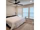 Bright bedroom with king-size bed and ceiling fan at 14315 Sapelo Beach Dr, Orlando, FL 32827