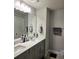 Modern double vanity bathroom with updated fixtures at 14315 Sapelo Beach Dr, Orlando, FL 32827