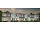Modern townhome building with gray siding at 14315 Sapelo Beach Dr, Orlando, FL 32827
