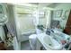 Bathroom with a bathtub, toilet, sink, and updated vanity at 1001 Eva St, Deltona, FL 32725