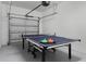 Finished garage converted into a game room with ping pong table at 1638 Moon Valley Dr, Davenport, FL 33896