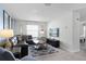 Spacious living room with sectional sofa, TV, and plenty of natural light at 1638 Moon Valley Dr, Davenport, FL 33896